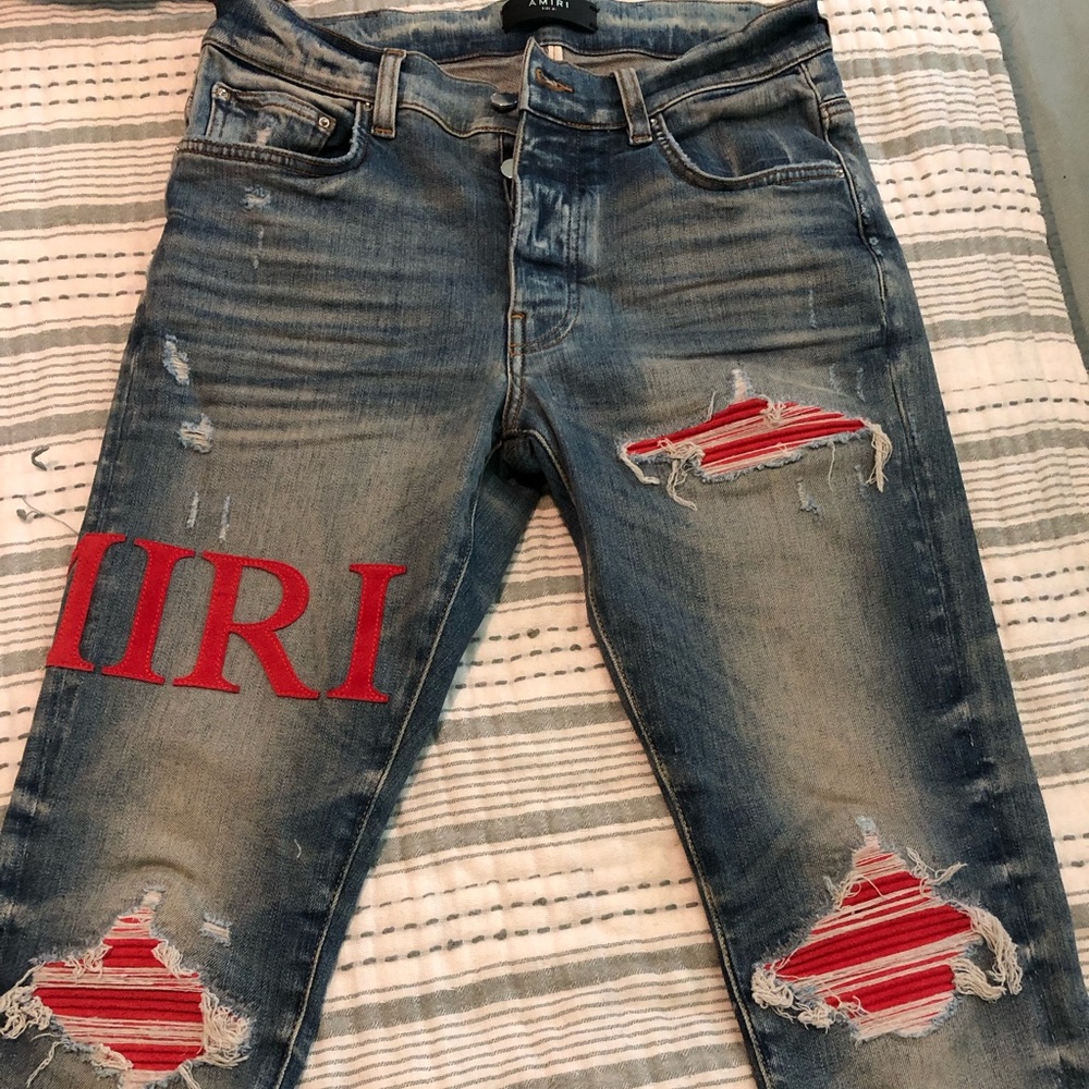 Skinny fit distressed and embellished jeans